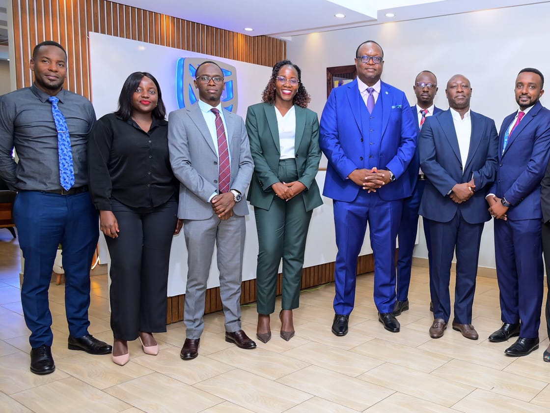 Apio, in green, with UETCL colleagues and senior management